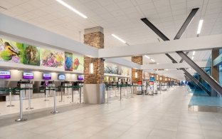 A photo of airport check in counters. 